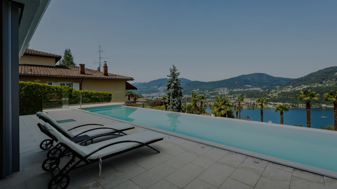Mansion infinity pool with city skyline view