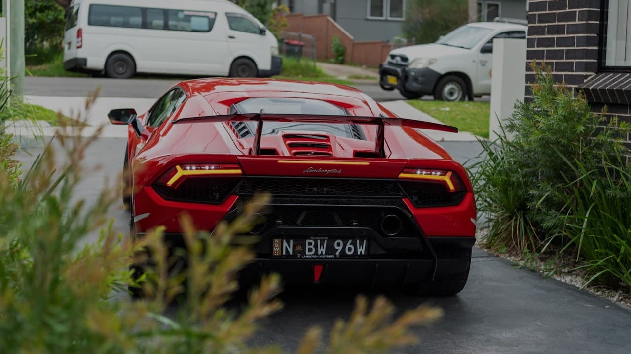 Lamborghini Aventador in front of villa